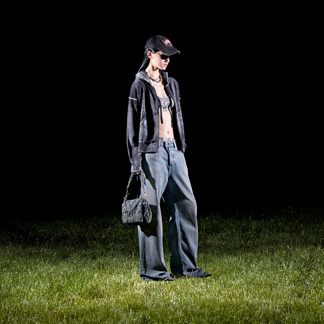 A woman wearing Diesel jeans